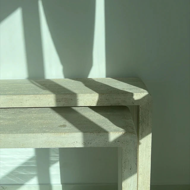 Curved two luxurious consoles made of light travertine